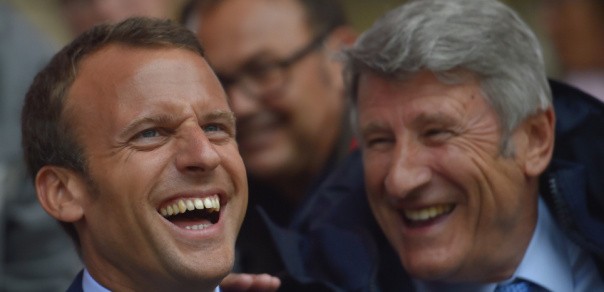 French Economy Minister Emmanuel Macron (L) and French 