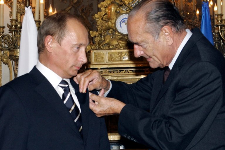 FILE - French President Jacques Chirac, right, hands over a rosette of the Legion of Honor to his visiting Russian counterpart Vladimir Putin during their meeting at the Elysee Palace in Paris, Friday Sept. 22, 2006. Ukraine’s wartime leader Volodymyr Zelenskyy has now been bestowed with France’s highest medal of honor. But there’s a problem: Russian President Vladimir Putin has the same medal. French President Emmanuel Macron pinned the Grand Cross of the Legion of Honor medal on Zelenskyy’s chest after the two met in the French presidential palace Thursday, Feb. 9, 2023 (ITAR-TASS, Presidential Press Service, Vladimir Rodinov via AP, File)